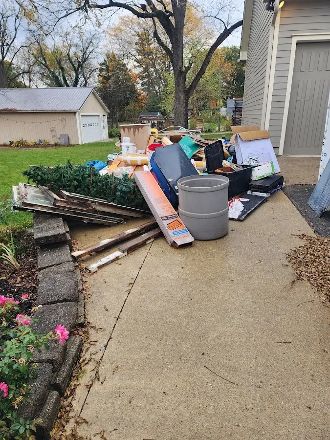 Dumpster being loaded with debris for 12 Yard Dumpster Rental in Lecanto